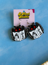 Load image into Gallery viewer, Cryptid Bookworm Earrings | Black Sparkle Acrylic Mothman Drop Earrings
