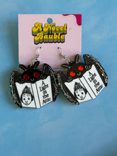 Load image into Gallery viewer, Cryptid Bookworm Earrings | Black Sparkle Acrylic Mothman Drop Earrings
